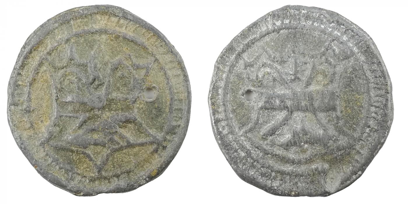 Herontdekt: een penning met aan de ene kant (rechts te zien) het wapen van de Duinenabdij
