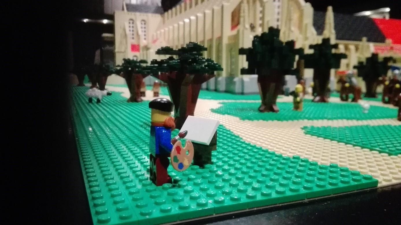 LEGO®-minifig die Pieter Pourbus moet voorstellen, bij de opmeting van het abdijdomein in de 16de eeuw